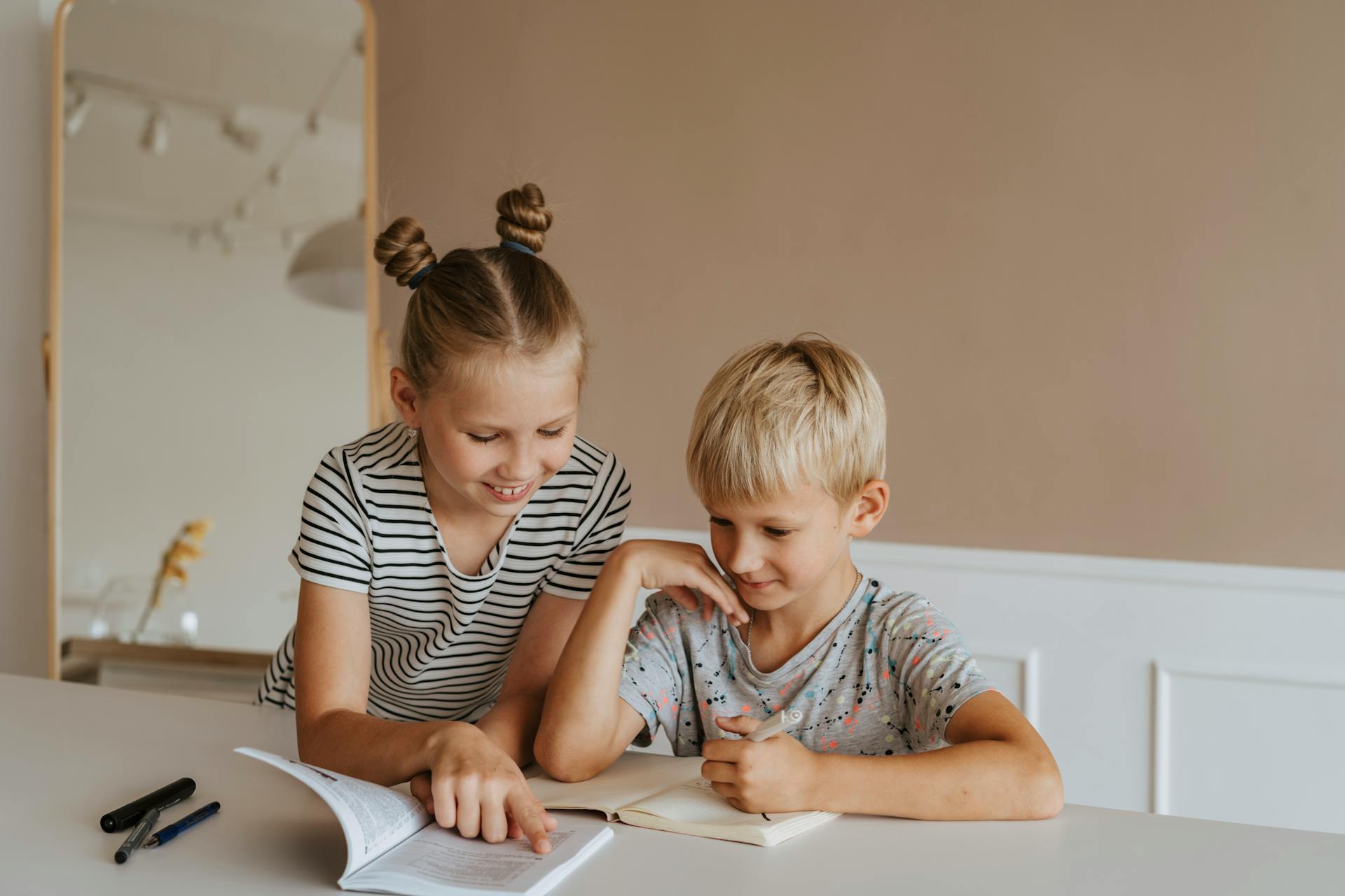 Two children reading and studying together