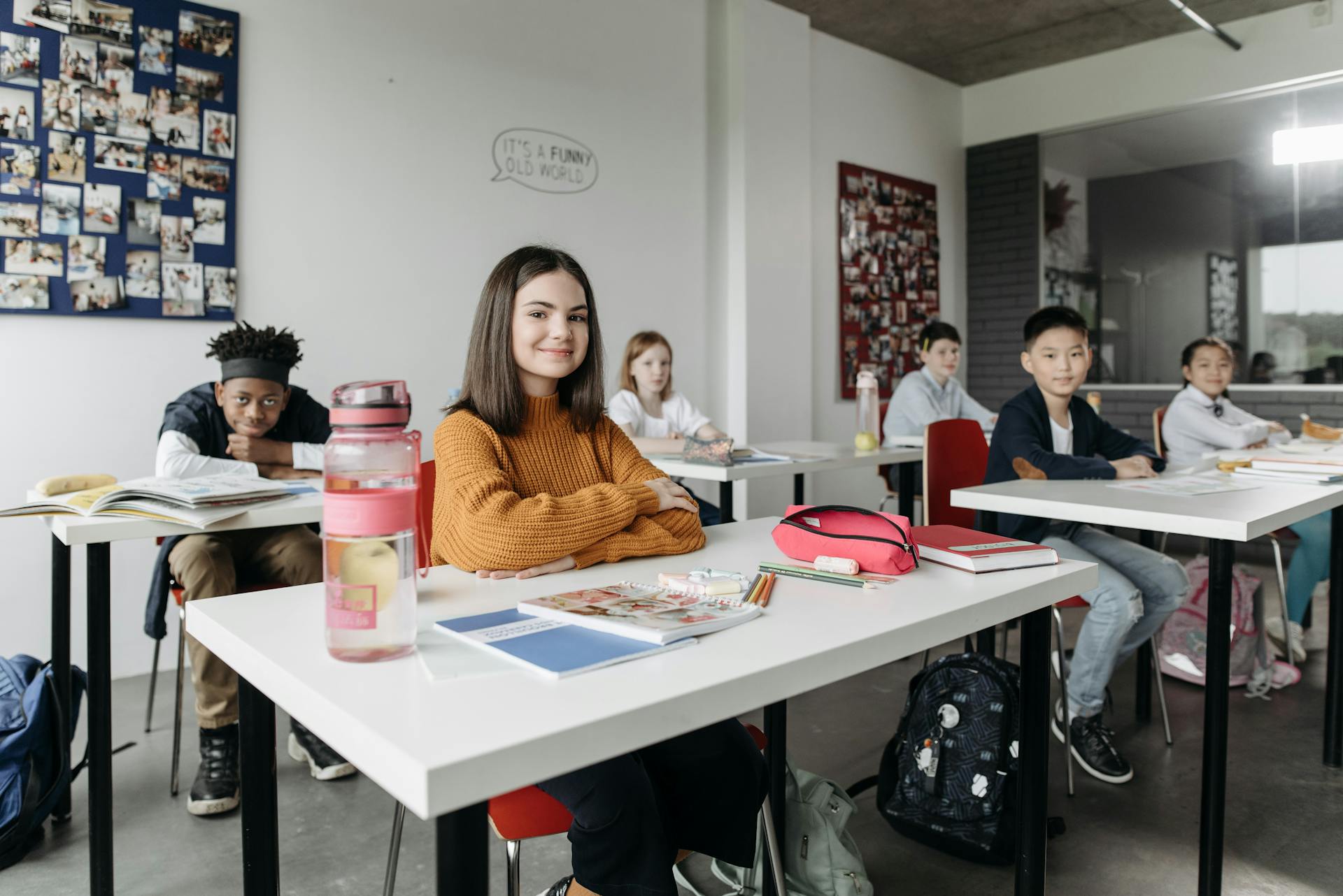 Students sitting at their desks in a bright, welcoming classroom